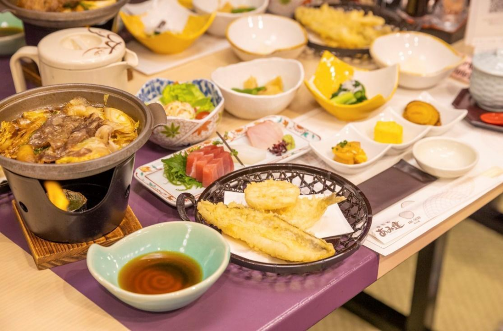 A table of traditional Japanese food on a Yakatabune trip